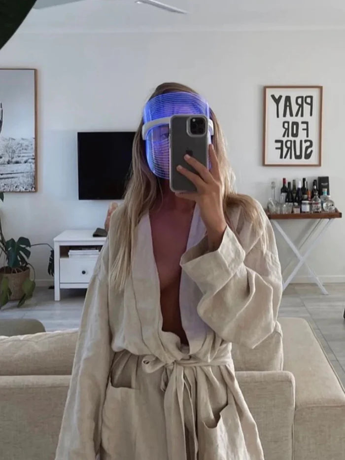 Woman in spa robe wearing Derma Therapy Mask