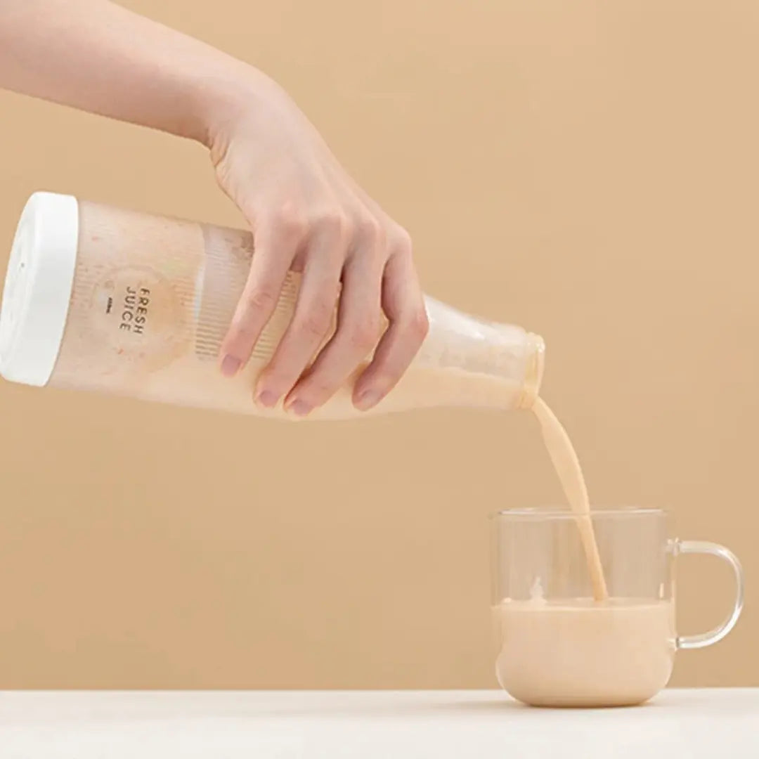 Pouring milkshake from blender