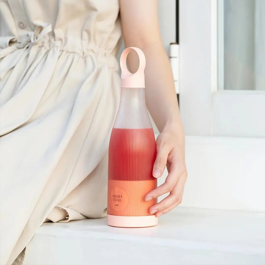 woman holding blender