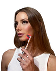 Redlight Therapy Wand woman using it on her face