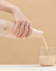 Pouring milkshake from blender